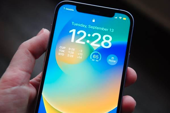Hand holding bright smartphone display