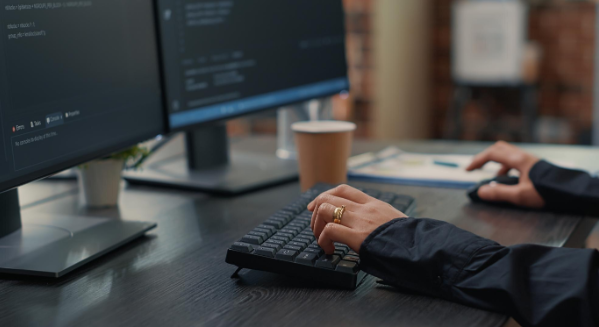 Specialist at a computer planning a move to new turnkey casino software